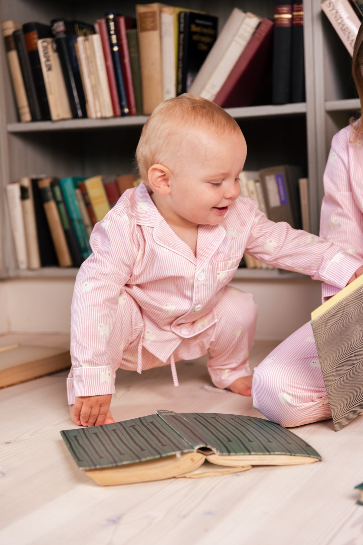 Toddler wearing the pink and white Pomeranian kids pajama