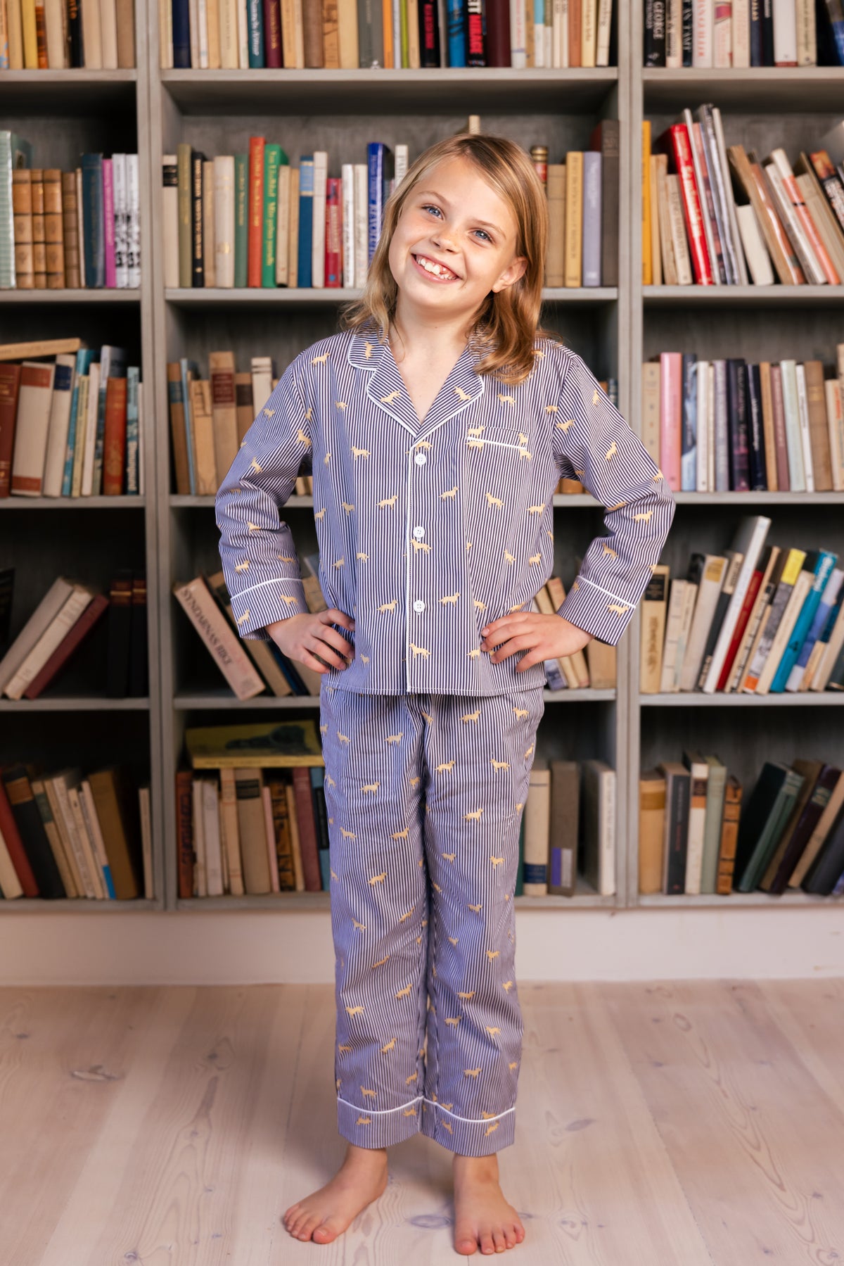Child wearing the navy and white Retriever kids pajama