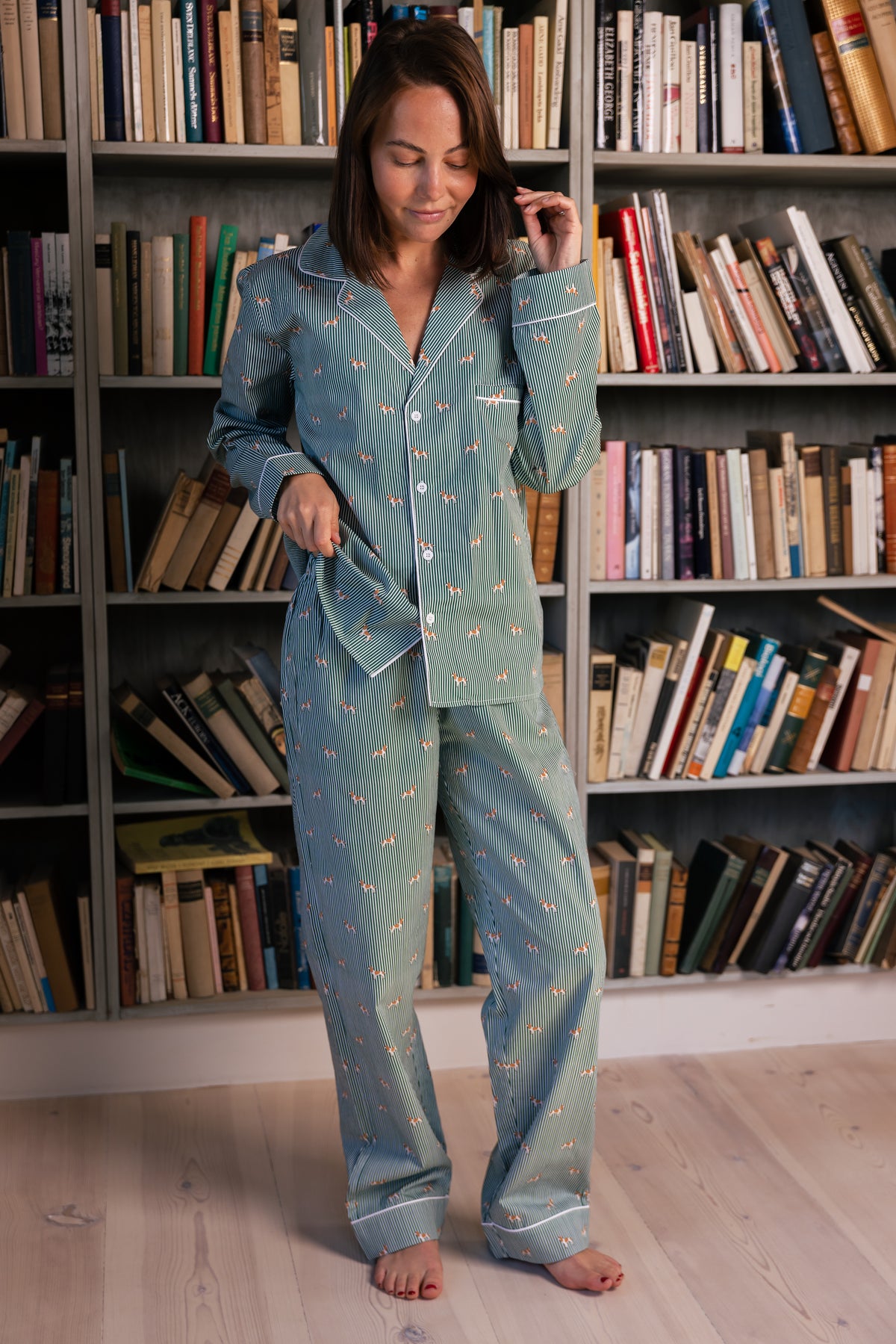 Adult wearing the complete green and white Spaniel unisex pajama set